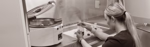 Platelet Rich Plasma being prepared in Type A2 Biosafety Cabinet. Tubes are being prepared to go into the centrifuge to the left.